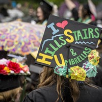 Ellinoa Blake, a critical race, gender and sexuality studies graduate, wears a mortarboard hat with one of HSU's informal mottos, which was very appropriate for this rainy day commencement ceremony.