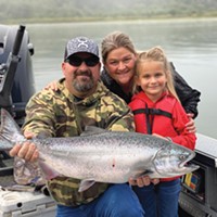 Ruby Dawn, with a little help from her father Pat and mother Michele, landed her first-ever salmon while fishing the Klamath River Saturday.