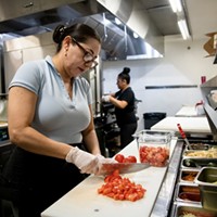 Cook Martha Garcia preps food in the kitchen at Verde Mexican Rotisserie in South Lake Tahoe on Oct. 6, 2021. Domi Chavarria, the owner of Verde Mexican Rotisserie, lost about $10K worth of inventory when they shut down for two weeks due to the Caldor Fire evacuation.