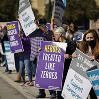 Hospital staffers and union organizers waved signs and banners in protest over staffing shortages at Kaiser Permanente Hospital in Roseville on Oct. 14, 2021.