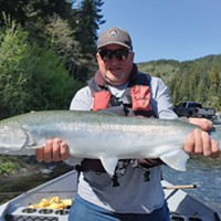 Marty Woods holds a Smith River steelhead caught in early April prior to the rise in flows. The spring rains hitting the coast now will have a positive impact on the health of salmon and steelhead runs, as well as the rivers themselves.
