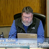 First District Supervisor Rex Bohn reads a written apology at the board's Jan. 31 meeting.