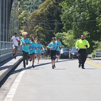 Youth from Orleans join in the run and carry the salmon batons across the Klamath River on May 19.