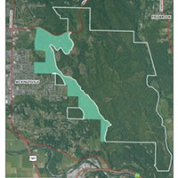 A map shows where the McKinleyville Community Forest, highlighted in green, sits in relation to the town and the rest of the Green Diamond Resource Co. property.