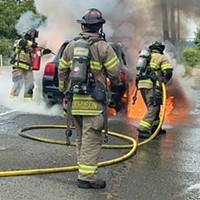 Arcata Fire District firefighters work to extinguish a vehicle fire in Bayside.