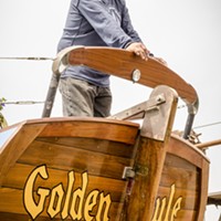 Michael Gonzalez, of Trinidad, pauses for a moment on the rear deck of the Golden Rule prior to its launching on Saturday, June 20 at the Zerlang & Zerlang  boat yard on the Samoa peninsula. He said he was easily persuaded to join the restoration project over three years ago when he heard it was a wooden boat.