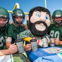Jacks football players and mascot "Lucky" pose with reusable cups.