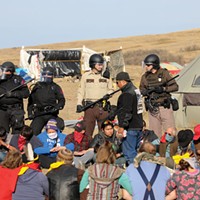 A group of protesters locked arms to create a barricade against police during a Morton County sheriff-led push to remove demonstrators from the pathway of the Dakota Access Pipeline on Oct. 27.