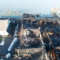 An overhead view of the remains of the commercial building.