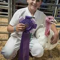 Rylan Lommori, of the Hydesville 4-H club, with his Grand Champion turkey.