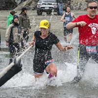 Crystal Mendez (left) and  Chris Schinke raised a splash at the Little River crossing in the 8 3/4-mile race.