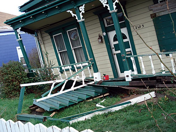 A house on California Street slipped off its foundation. - FILE