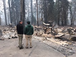 SUBMITTED - North Coast Assembymember Jim Wood, left, stands next to Paradise high school principal Loren Lighthall, who is seeing the remains of his home for the first time on Nov. 14.