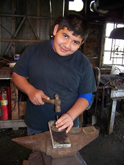COURTESY OF ERIC AND VIVIANA HOLLENBECK - Jose Pacheco working on a Blue Ox school project in 2013.