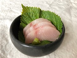 PHOTO BY JENNIFER FUMIKO CAHILL - Mahi mahi sashimi on a shiso leaf.
