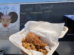 PHOTO BY JENNIFER FUMIKO CAHILL - A smothered chicken leg with some fried okra.