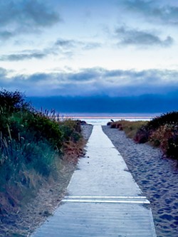 PHOTO BY MEG WALL-WILD - A wheelchair-accessible mat installed at Clam Beach.