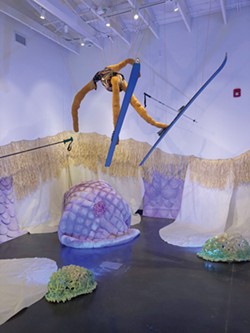 PHOTO BY GABRIELLE GOPINATH - Nancy Tobin's grass skirt-fringed CRy-Baby installation, with its foamy clouds and fabric figures.