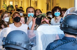 FILE - Protesters occupying Siemens Hall and police engage in a tense standoff on April 22 before police attempted to clear the building.