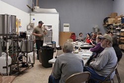 PHOTO BY CARRIE PEYTON DAHLBERG. - Josh Reed offers beer-making tips during a free class on National Learn to Homebrew Day.