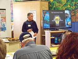 Affordable Homeless Housing Alternatives President Nezzie Wade presents information about a sanctuary camp proposal on March 7. Photo by Linda Stansberry
