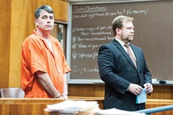 PHOTO BY MARK MCKENNA - Gary Lee Bullock (above left) stands next to his attorney, Kaleb Cockrum, during his arraignment on charges that he murdered St. Bernard’s Catholic Church pastor Eric Freed on New Year’s Day of 2014. Bullock, who is currently standing trial, has since entered dual pleas of not guilty and not guilty by reason of insanity in the case.