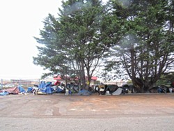 PHOTO BY LINDA STANSBERRY - Belongings wait for owners at Koster and Washington.