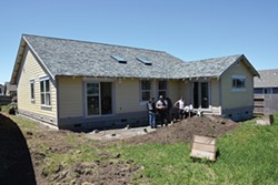 PHOTO BY AMY BARNES - The house on Maplewood Drive is nearly complete. Building Trades students have helped build it from the ground up and students in Dave Enos' Architectural Design class drew the plans.