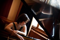 51a6d2ff_smiling-profile-at-piano-color-june2011-1mg.jpg