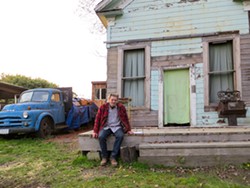 PHOTO BY AMY BARNES - Eric Hollenbeck sits at the Blue Ox Millworks.