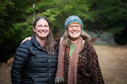 PHOTO BY AMY KUMLER - Sanctuary Forest Executive Director April Newlander (left) with Tasha McKee, the nonprofit&#39;s water program director.